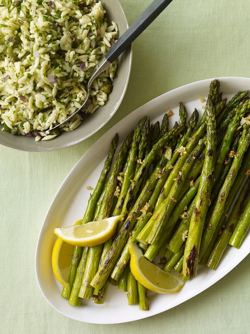 Platter of Grilled Asparagus with Lemon and a Bowl of Herbed Rice