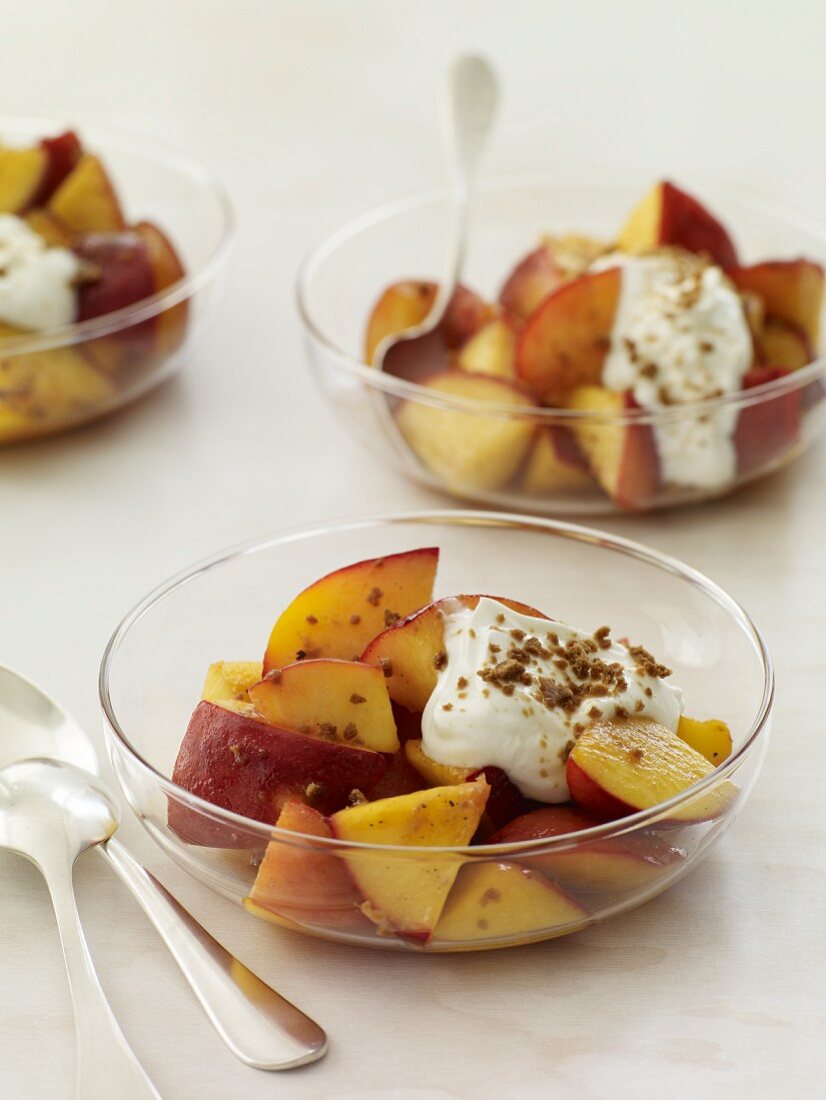 Chopped Stone Fruit in Glass Bowls with Cream; Spoons