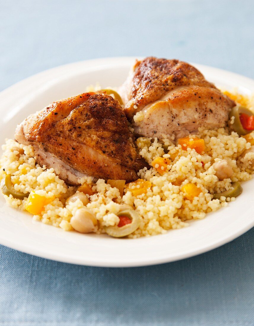 Spicy Roasted Chicken on a Bed of Couscous with Garbanzo Beans and Green Olives