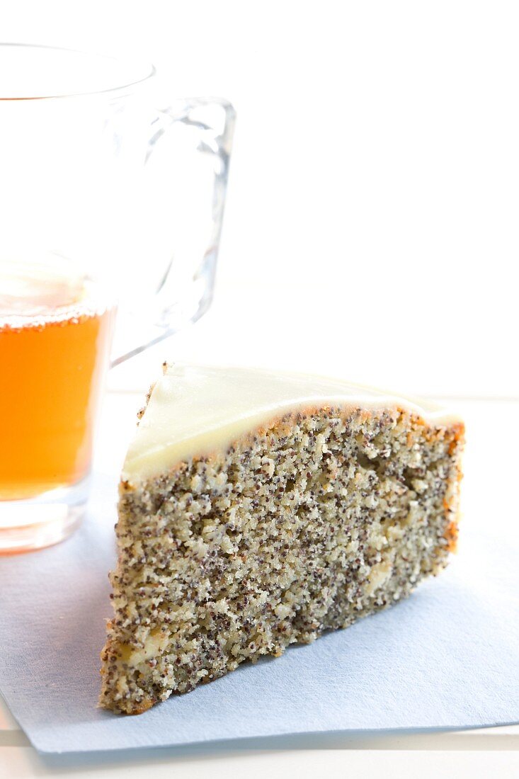 A slice of poppy seed cake with white chocolate