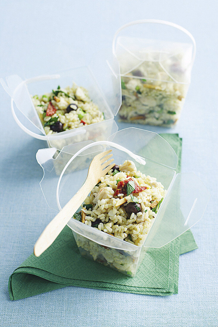 Rice salad with chicken, dried tomatoes and olives
