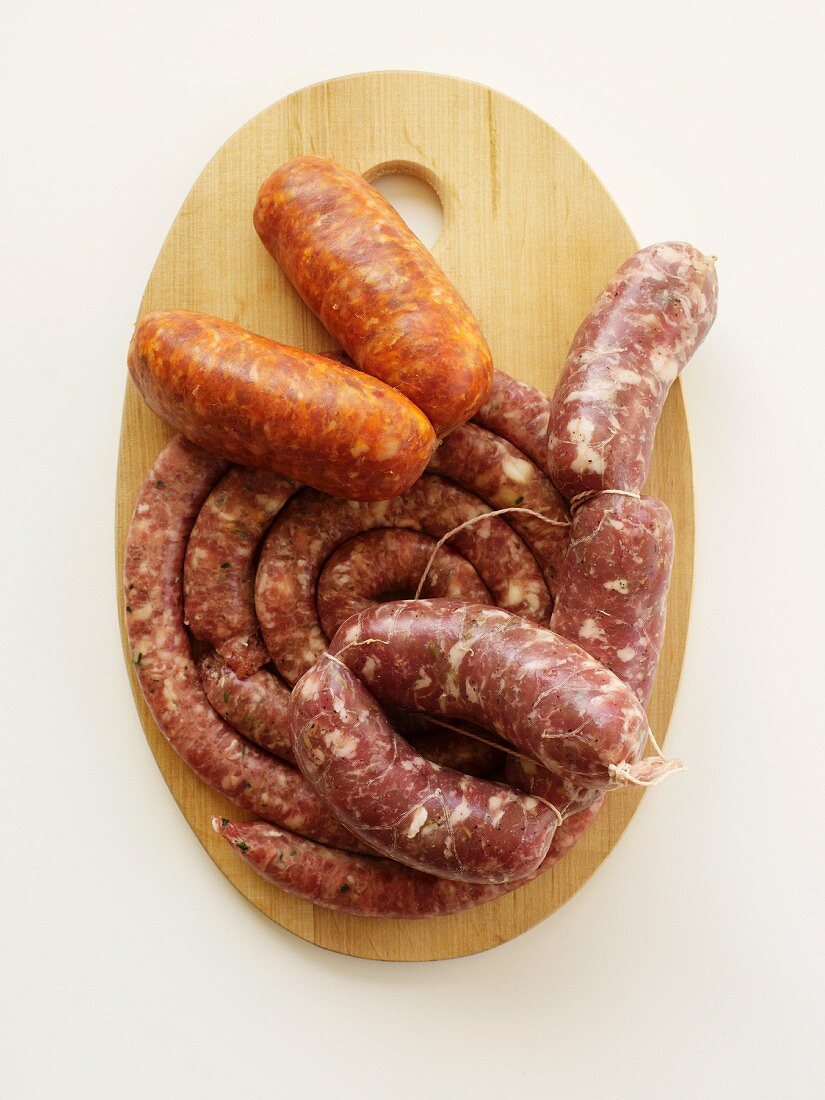 Two Types of Sausage on a Cutting Board; From Above
