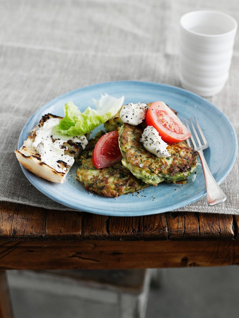 Plate of zucchini fritters with bread