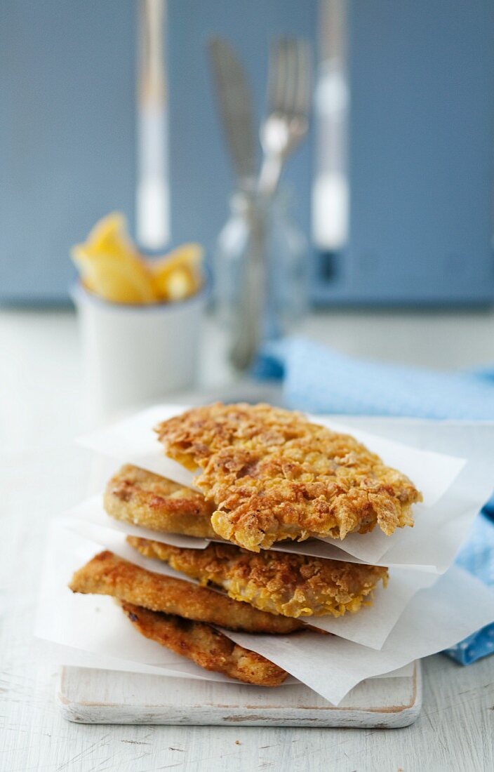 Schntizel Stacked with Parchment Paper Separating Them