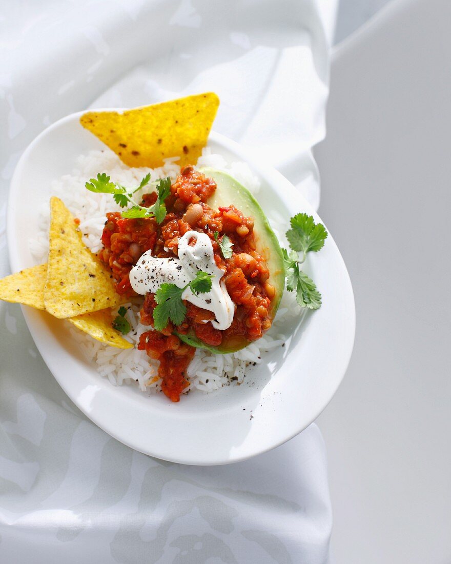 Plate of avocado stuffed with chili