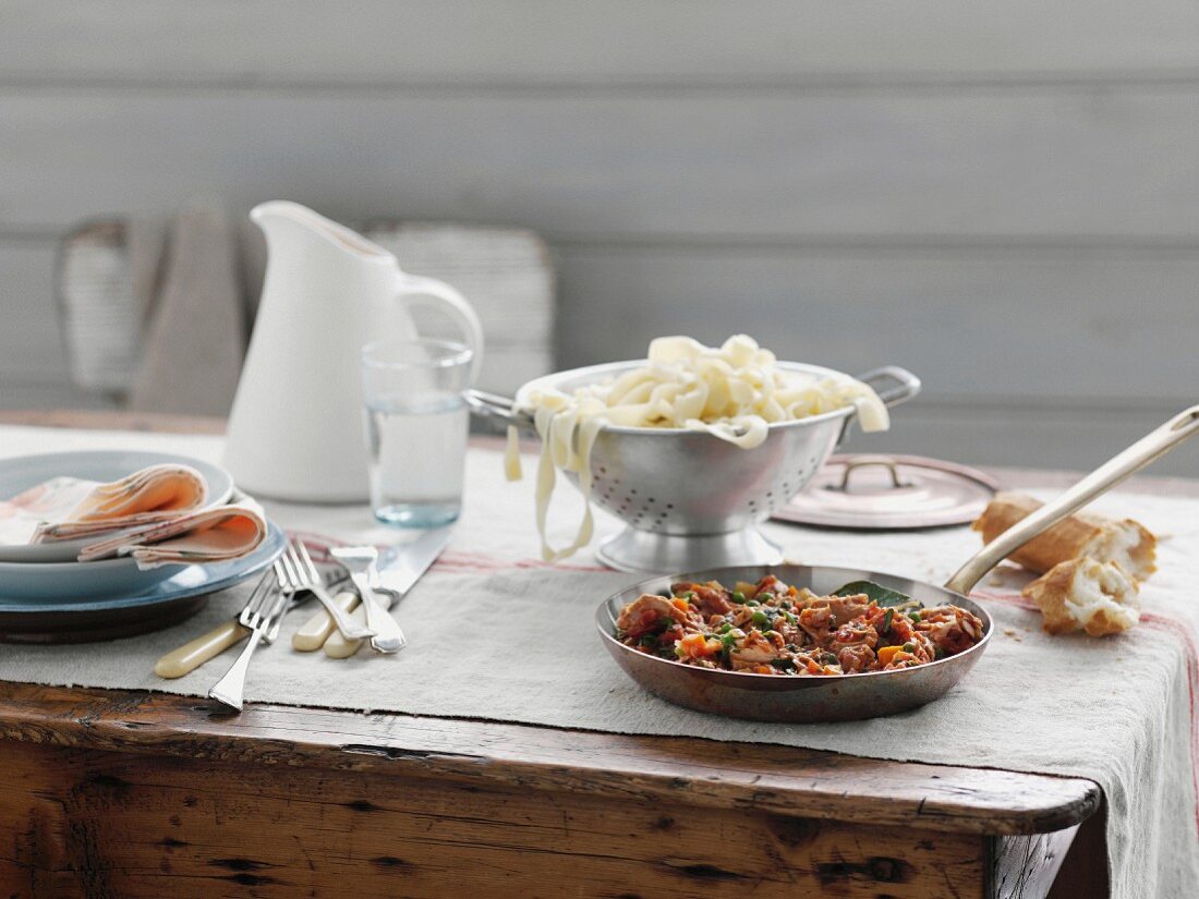 Pasta and pan sauce on table