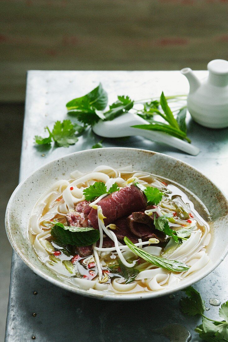 Bowl of pho soup with noodles