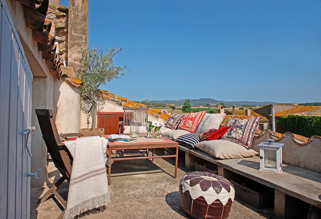 Sunny day in a comfortable seating area on a Mediterranean roof terrace
