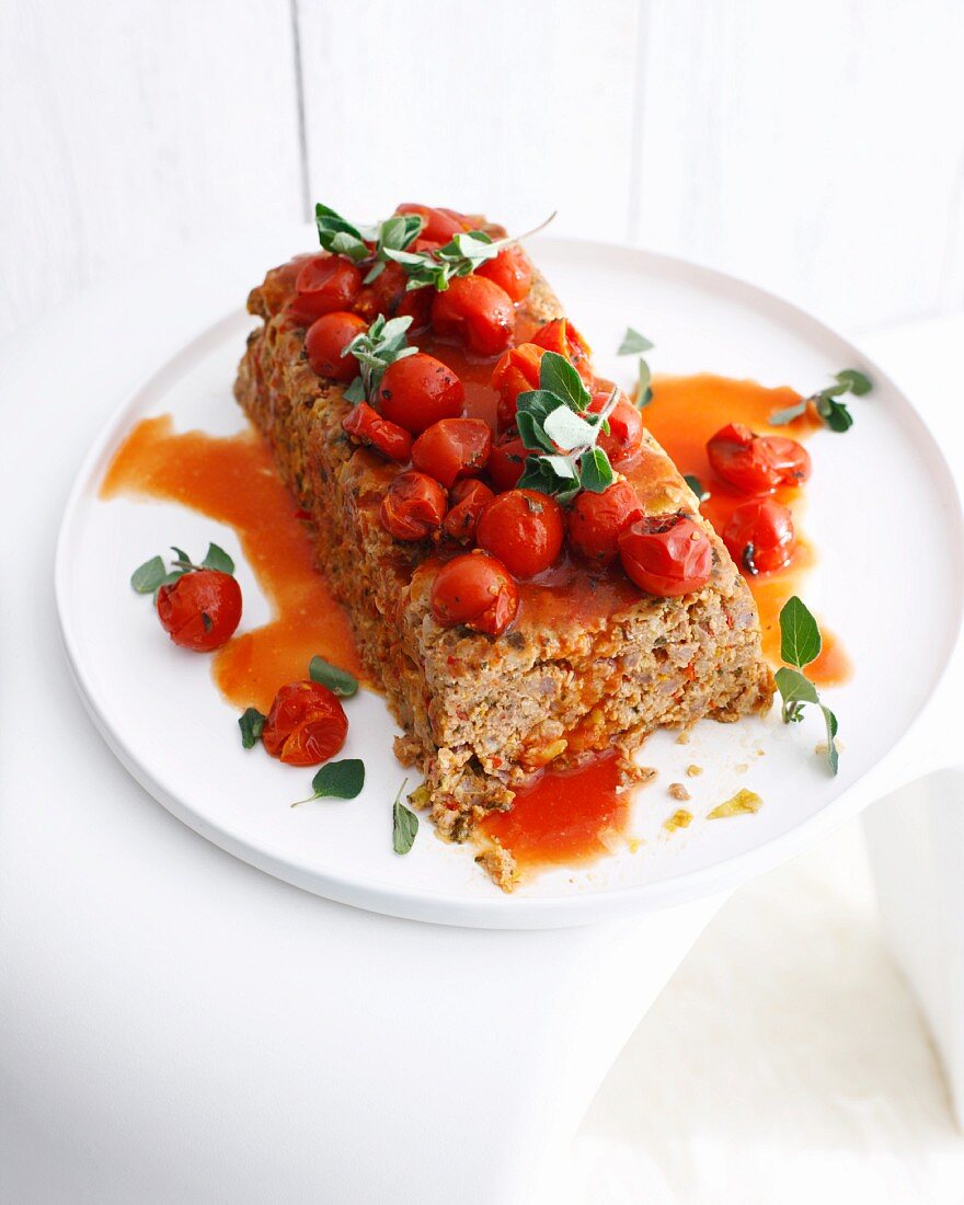 Plate of meatloaf with tomatoes
