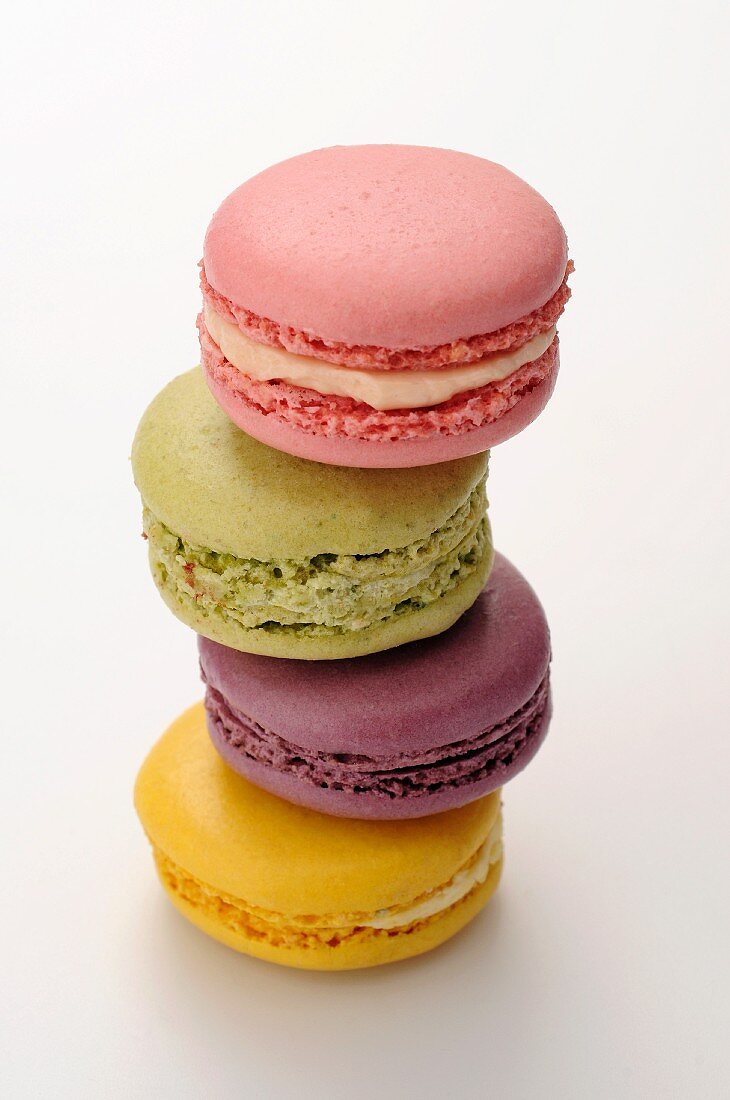 A stack of four different colours macaroons