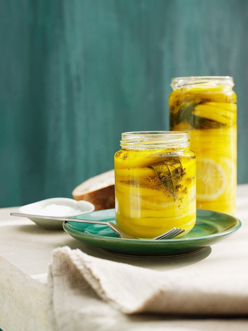 Jars filled with lemons and oil