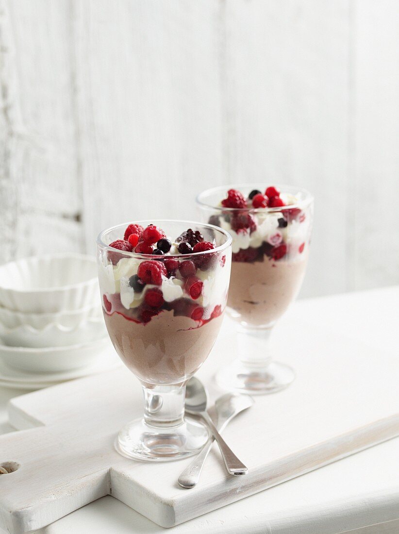 Bowls of chocolate mousse with fruit