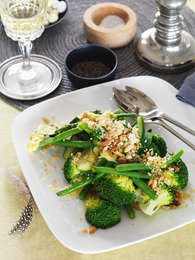 Green vegetables with lemon, garlic and pine nuts