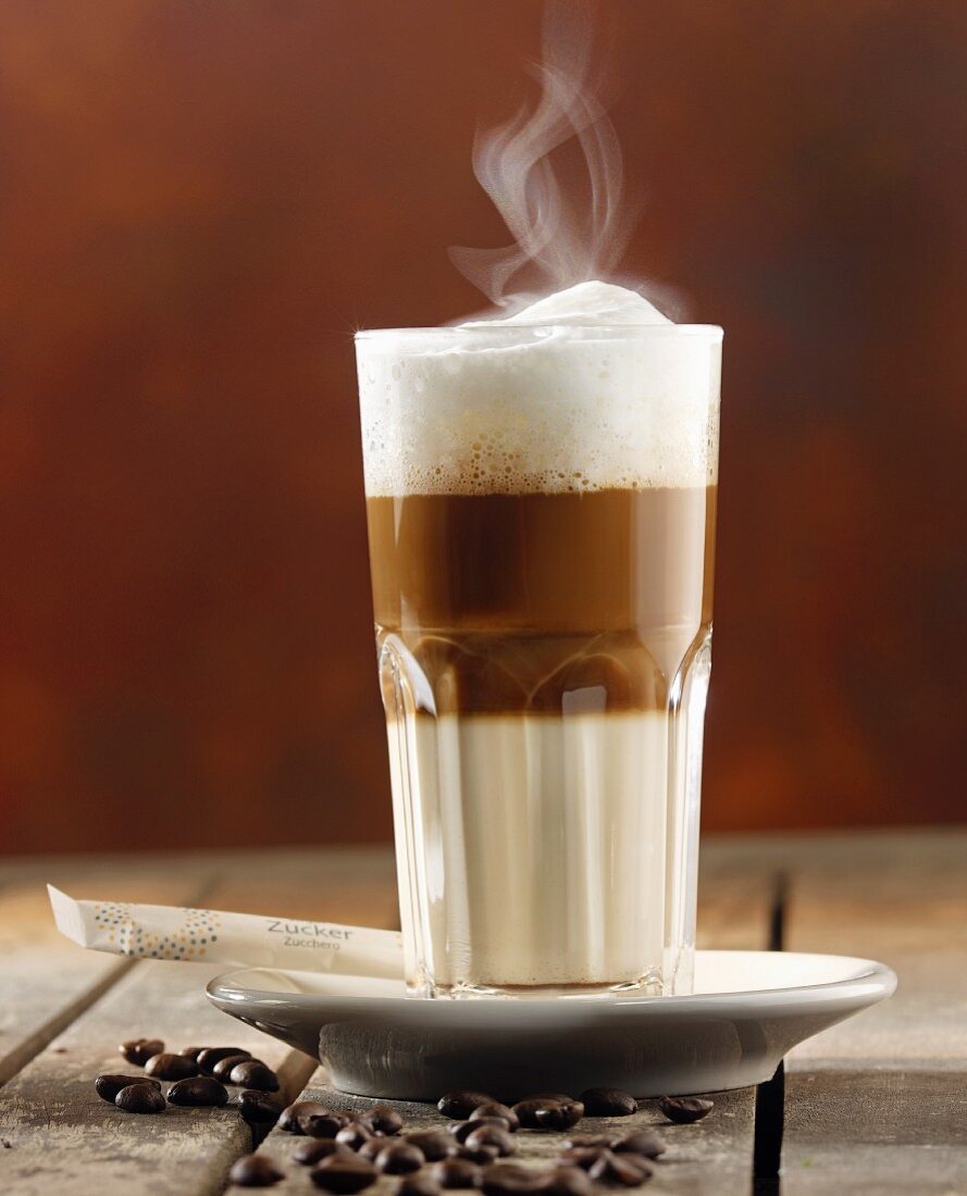 A glass of steaming latte macchiato