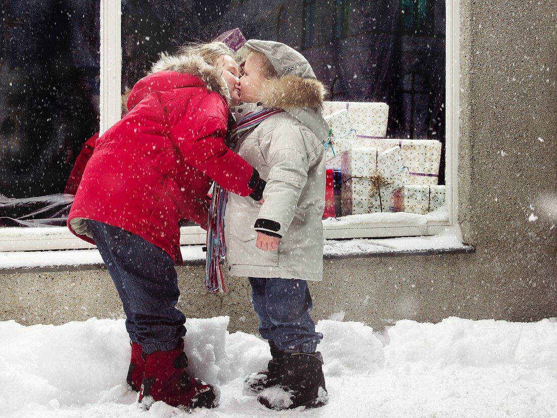 Children kissing in snow