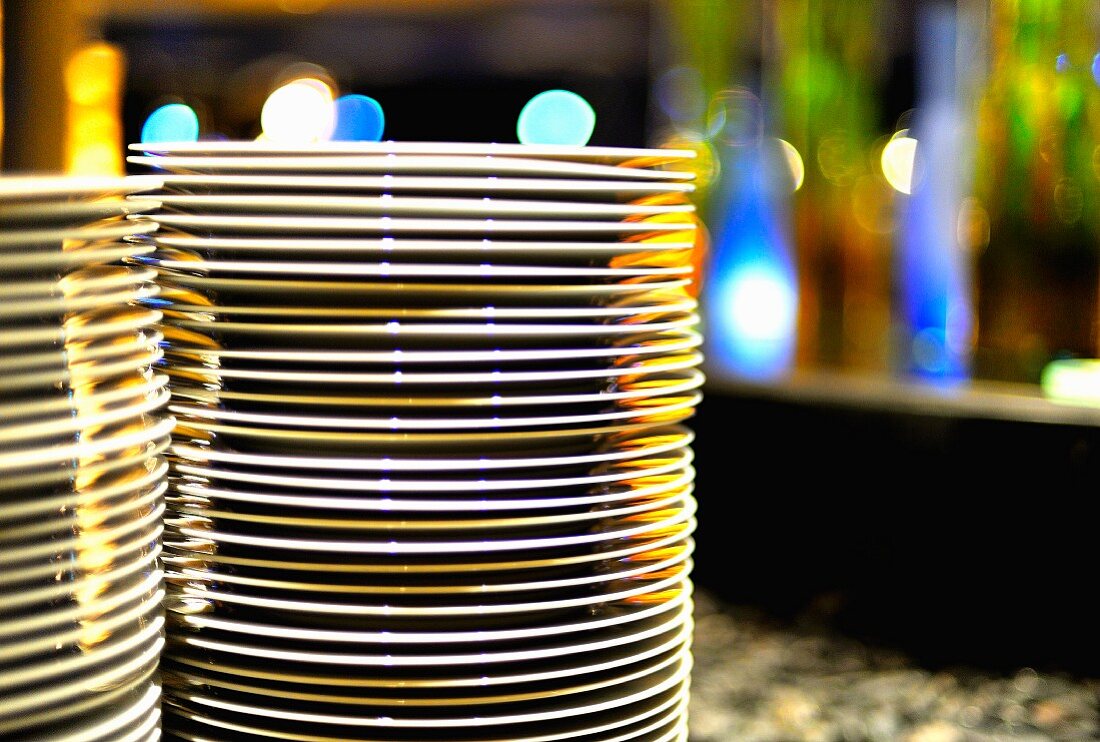 A stack on plates on a buffet table
