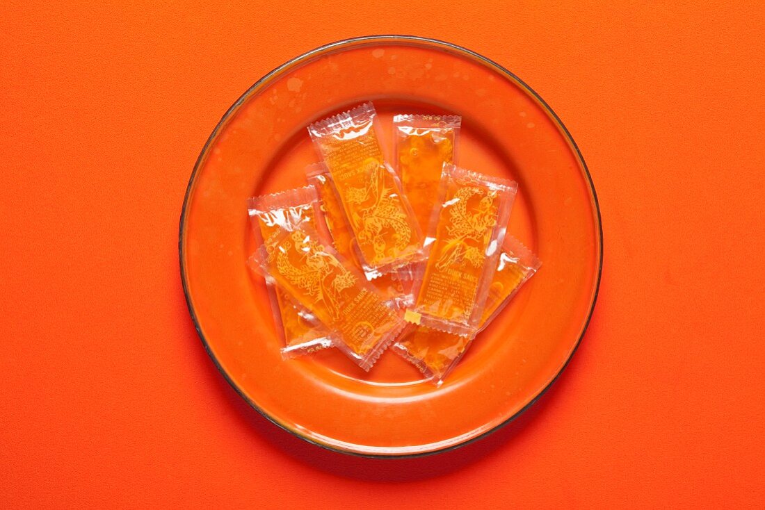 Packets of Duck Sauce on a Plate