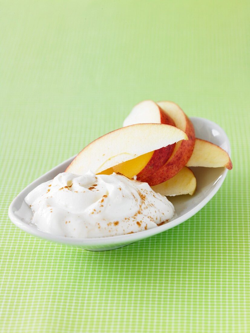 Sweet Yogurt with Apple Slices and Sprinkled Cinnamon