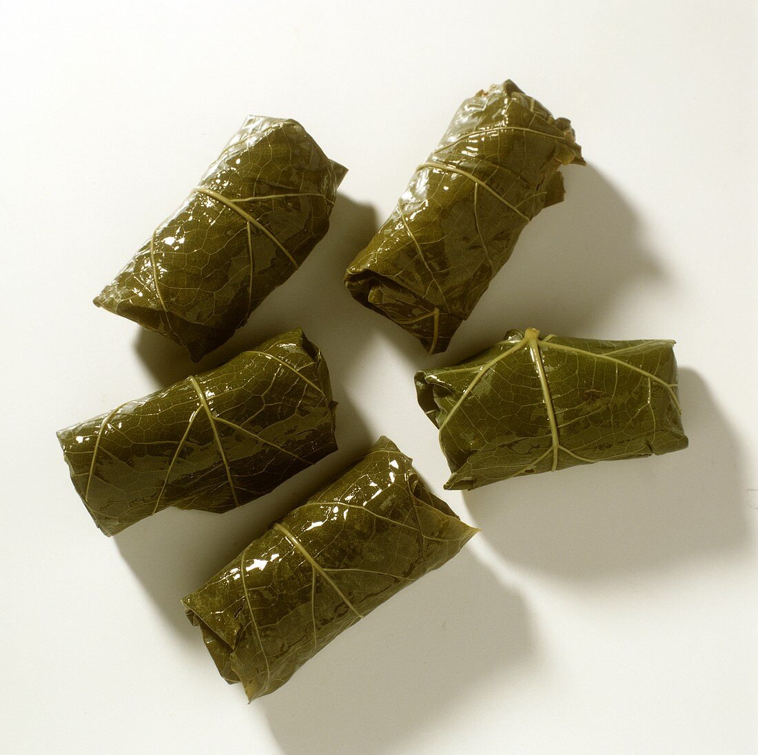 Five dolmades (stuffed vine leaves)