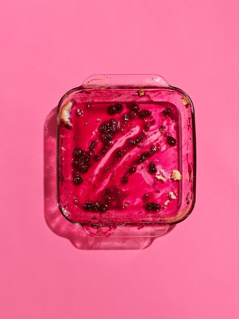 Leftover blueberry cobbler in a glass baking dish