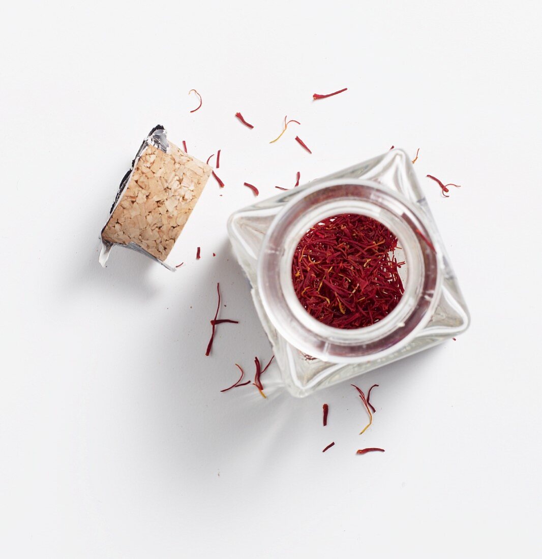 Saffron threads in a glass jar with a cork