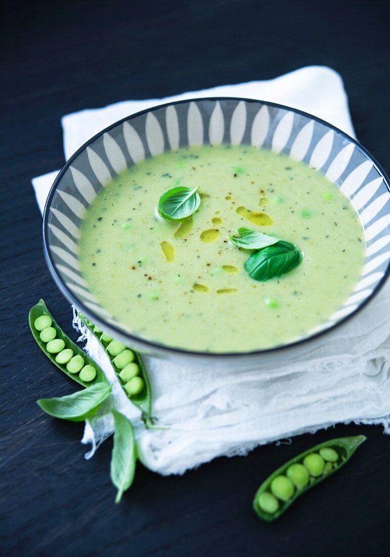 Cream of pea soup with basil and olive oil