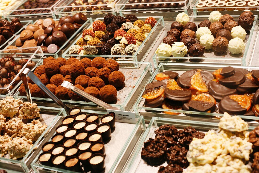 Many Chocolate Truffles and Sweets at the La Boqueria Market in Barcelona, Spain