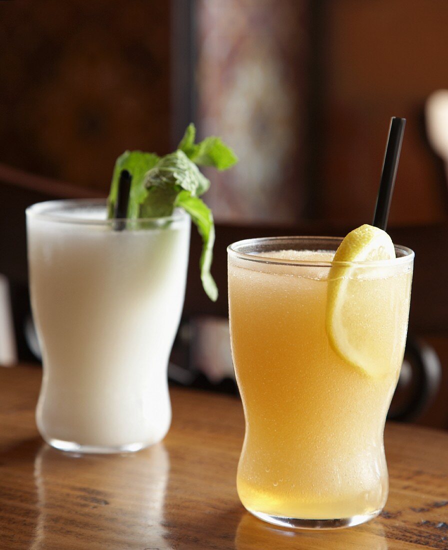 Spanish “Slushito” Drinks;White One is Coconut Rum Lemongrass Lime; Orange One is Grapefruit Bourbon Chamomile