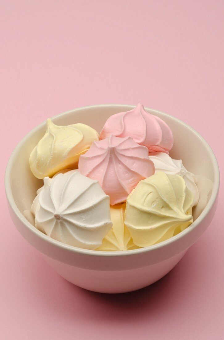 Bowl of Meringues on a Pink Background