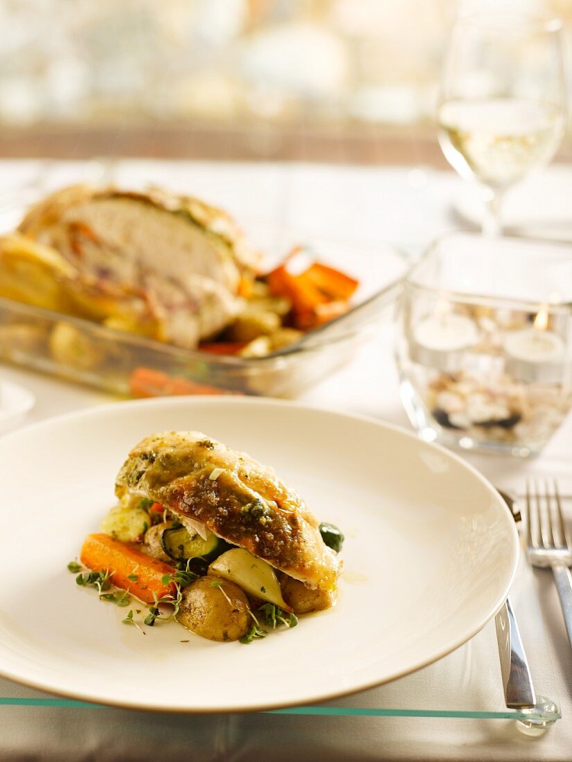 Roast chicken stuffed with vegetables and potatoes