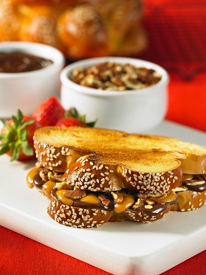 Toasted plaited loaf with chocolate and caramel cream and pecan nuts