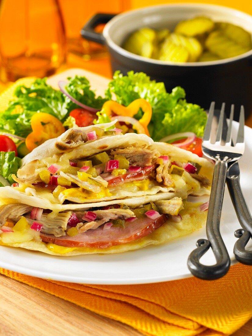 Tortillas filled with ham, artichokes and relish