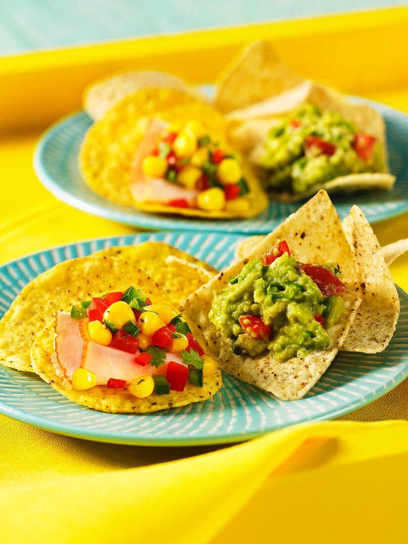 Tortilla chips with guacamole and corn relish