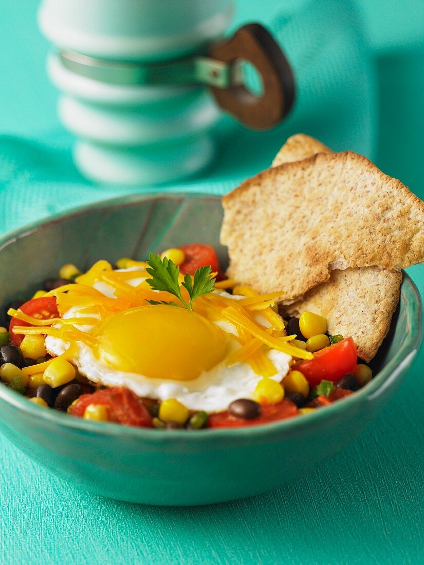 Tex Mex breakfast with a bean salad and a fried egg