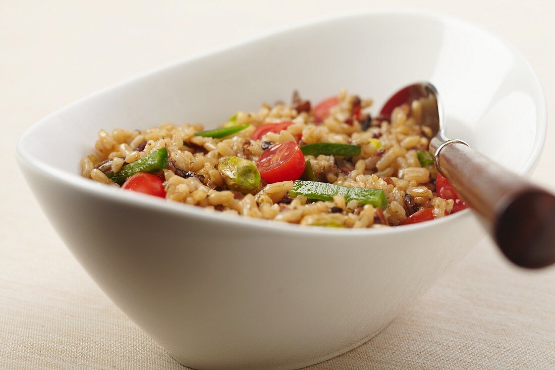 Bowl of Brown Rice with Cherry Tomatoes, Green Pepper and Pistachios