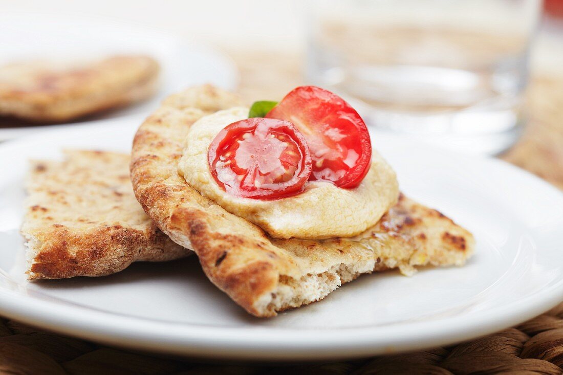 Pita Bread Topped with Hummus and Cherry Tomato