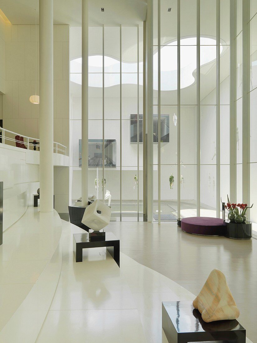 Lobby of modern building with floor to ceiling windows