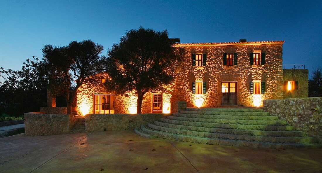 Front exterior Spanish villa at dusk