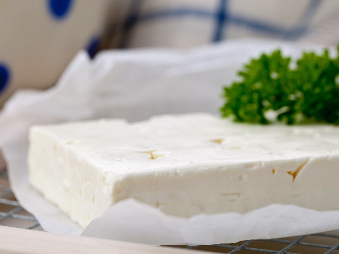 Feta with parsley on a piece of paper