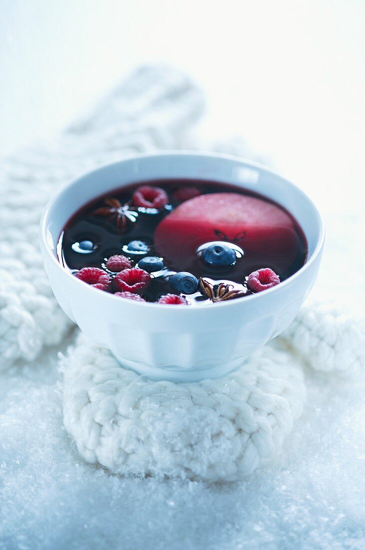 Red wine punch with apples and berries