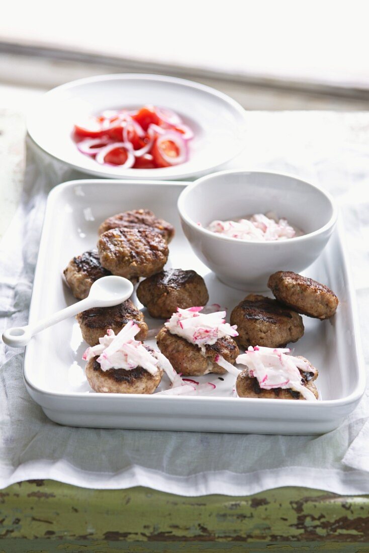 Grilled meat balls with a radish dip