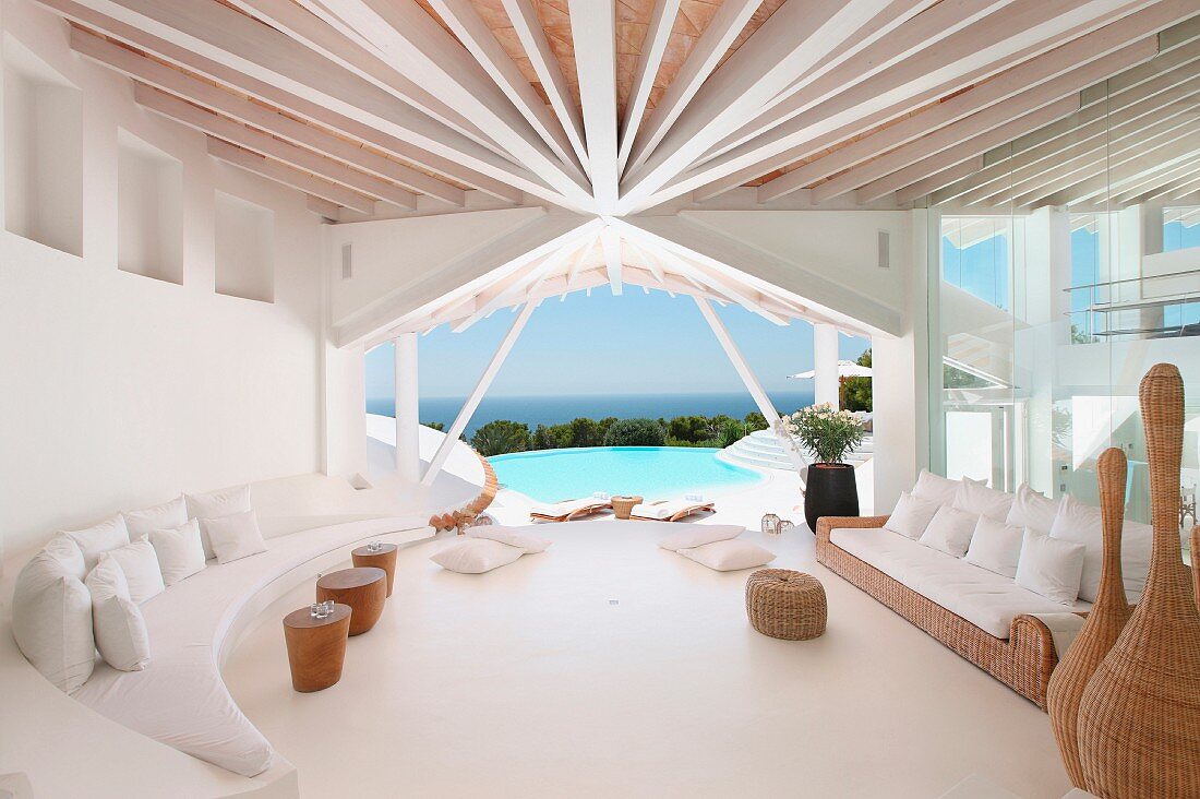 White living room in modern home with ocean view