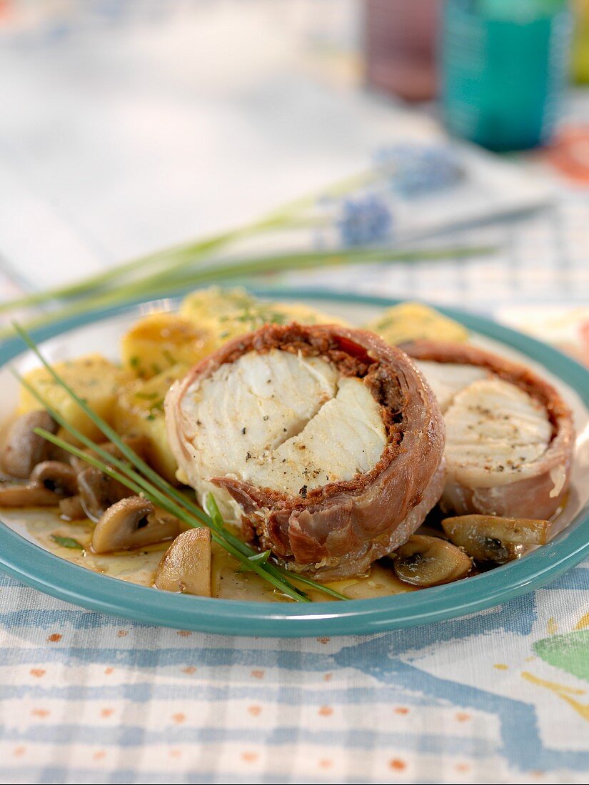 Monk fish wrapped in bacon with a mushroom sauce