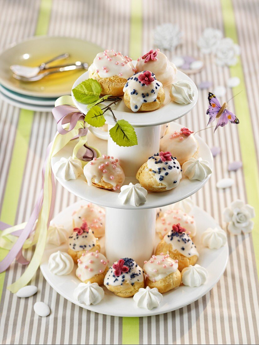 Decorated profiteroles on a cake stand