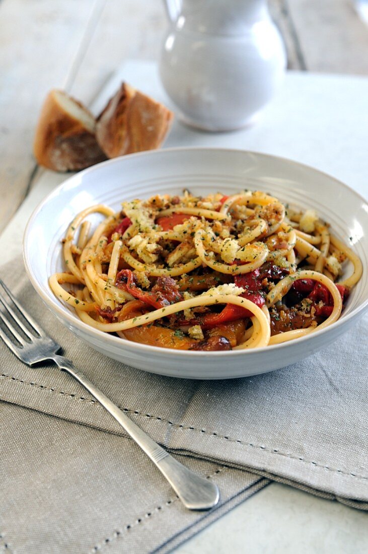 Bucatini pasta with roasted sweet bell peppers and herb and garlic crumbs