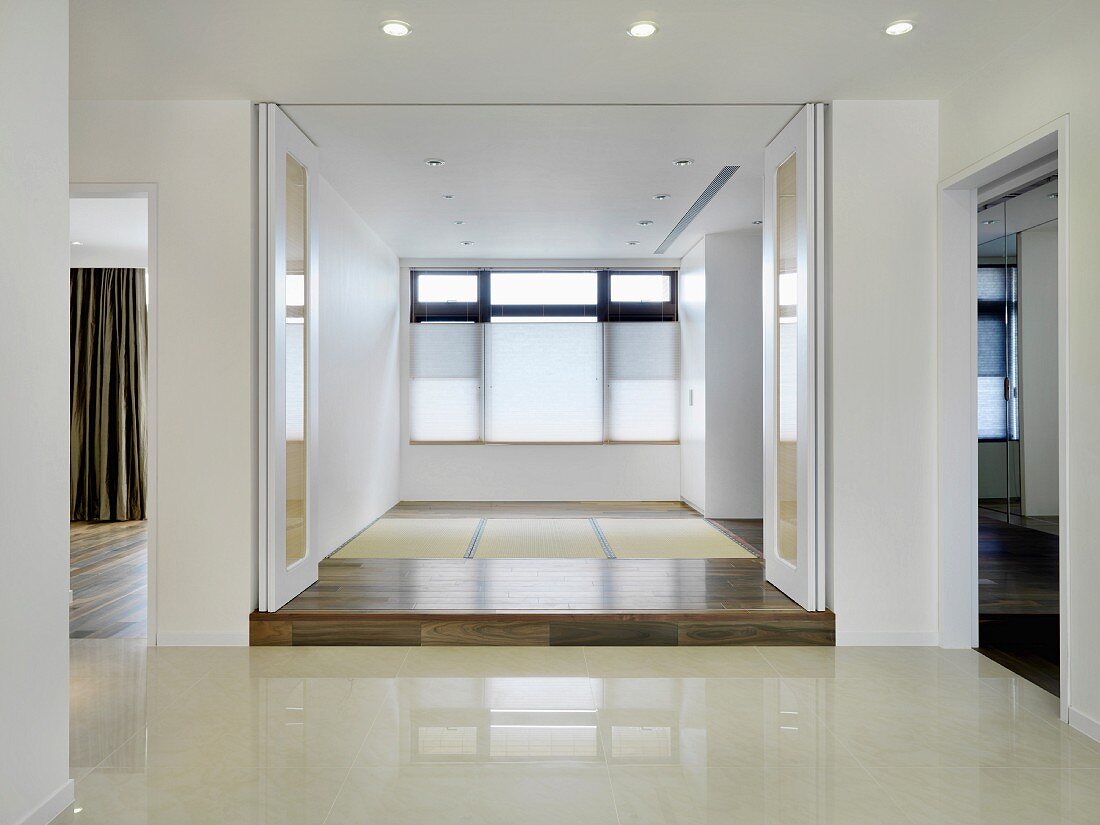 Empty modern home with white accordion doors