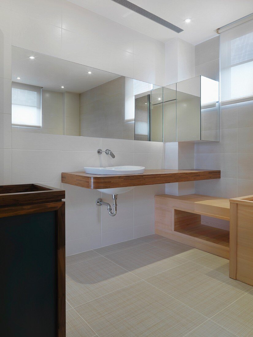 Floating counter and sink in modern bathroom