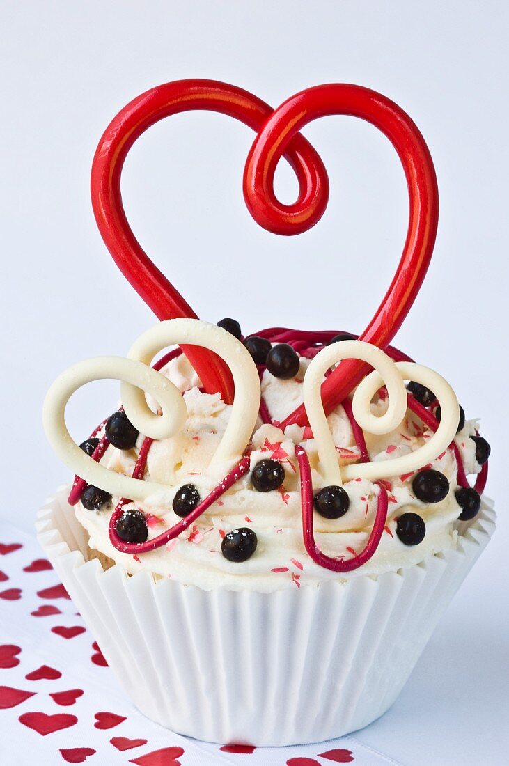 A cupcake decorated with hearts for Valentine's Day