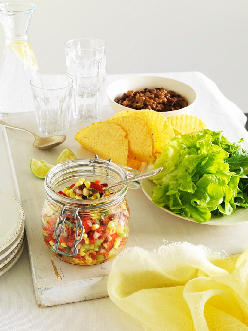 Corn salsa, taco shells, lettuce and chillis