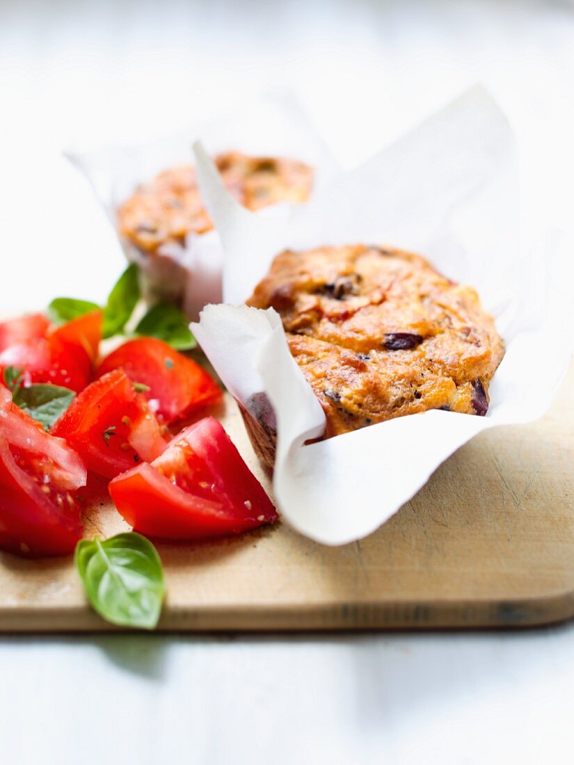 Cheese and tomato muffins, fresh tomatoes and basil